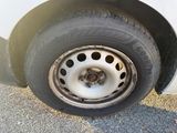 a close up of a flat tire on a car