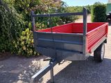 a red truck that is parked on the side of the road