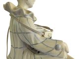 a figurine of a man sitting on a chair