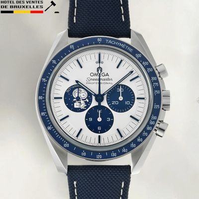a close up of a watch with a blue strap on a white background