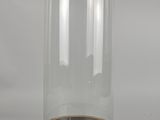 an image of a clear glass dome with a wooden base