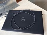 a laptop and a mouse on a table in a room