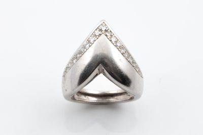 a close up of a diamond ring on a white background