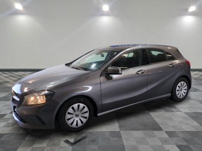 the mercedes b - class is parked on a checkered tile floor