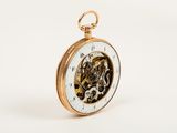 a gold pocket watch with a white dial on it
