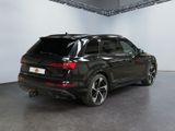 the rear end of a black audi suv parked in a garage