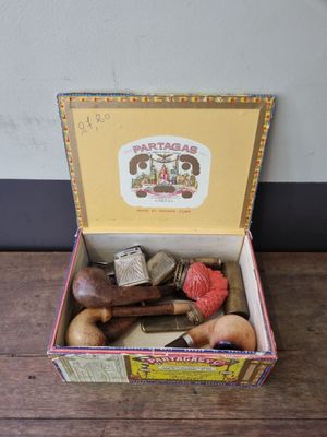a box with a variety of items in it on a table