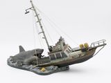 a model of a boat with a shark on it