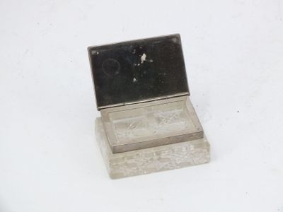 a small silver box with a mirror on it