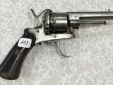 a gun that is sitting on a table with a tag on it