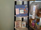 a book shelf with books on it in a room