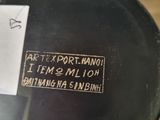 a close up of a black vase with a sticker on it