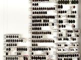 a large display of wine bottles on the wall