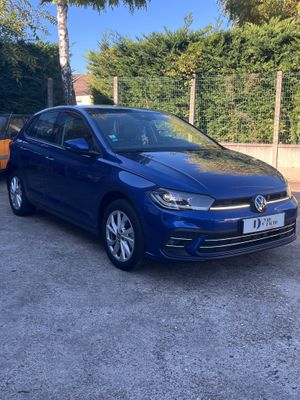 a blue volkswagen e - golf parked in a parking lot
