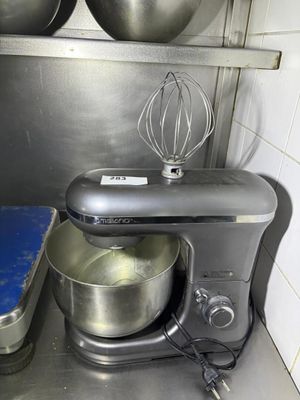 a mixer in the kitchen with a blue mat on the floor