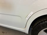 a white car with a sticker on the side of it