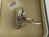 a ring in a box with a price tag on it