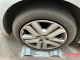 a close up of a flat tire on a car