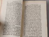 an open book that has a picture of a cat on top of it