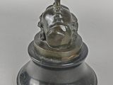 an image of a statue of a woman holding a bird on top of a pedestal