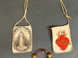 two small purses with a picture of a woman and a child on them