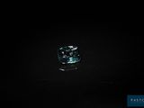 a blue diamond in the dark with a black background