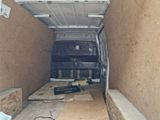a van that is sitting in the back of a truck