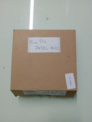 a cardboard box with a sticker on it that says i ' m pe intel nuc