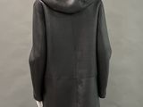 the back of a mannequin wearing a black coat with a hood