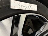 a close up of a tire with a measuring tape on it