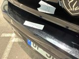 a close up of a car with a sticker on it ' s bumper