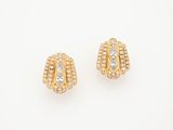 a pair of yellow gold and diamond earrings