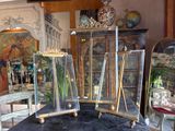 a table with three glass cases on it in a room