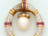 a pearl and diamond circle pendant