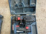 two tools in a case on the ground