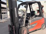 a forklift truck that is parked in front of a building