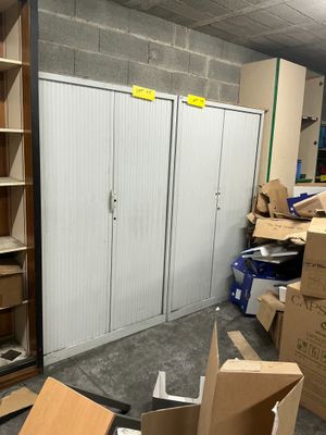 a room with a bunch of boxes and boxes on the floor