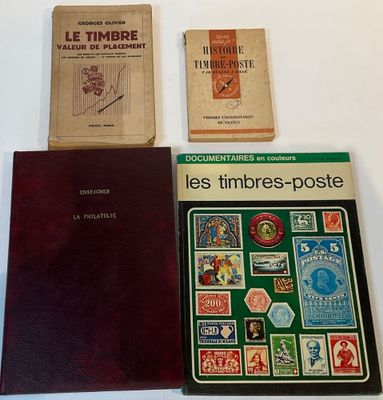 three books on a white table with a red book and a brown book