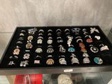 a display case with many different rings on it