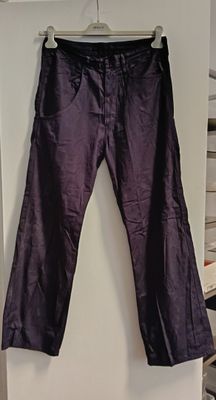 a purple pants hanging on a wall in a room