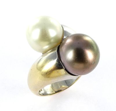 an image of a close up of a ring with two pearls on it