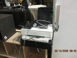 an image of a computer and speakers on a table