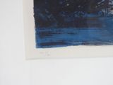a picture of a blue and black painting hanging on a wall