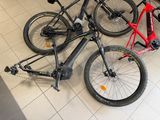 two bikes that are sitting on the floor in the store