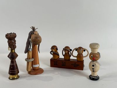 a lot of wooden figurines that are sitting on a table