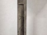 a metal pole with a clock on top of it