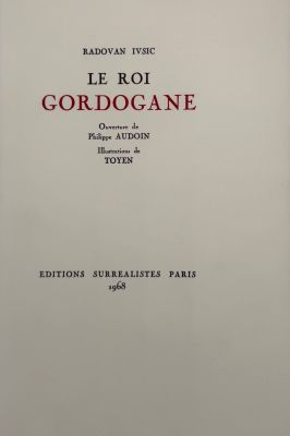 a white book with red writing on the cover