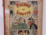 un vieux livre pour enfants sur lequel figure l'image d'un chien et d'un chat