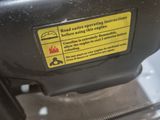 a close up of a motor with a warning label on it