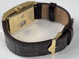an image of a close up of a wrist watch on a white surface